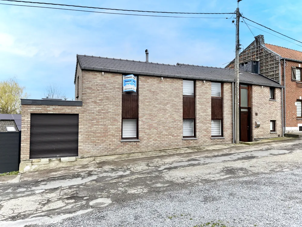 Maison 3 façades avec garage, véranda et terrasse